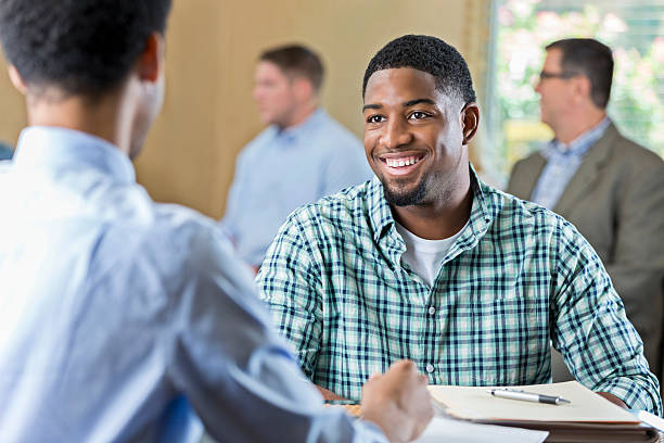 https://aidoos.com/media/images/smiling-african-american-young-adult-at-a-job-interview_albA6Ky.jpg