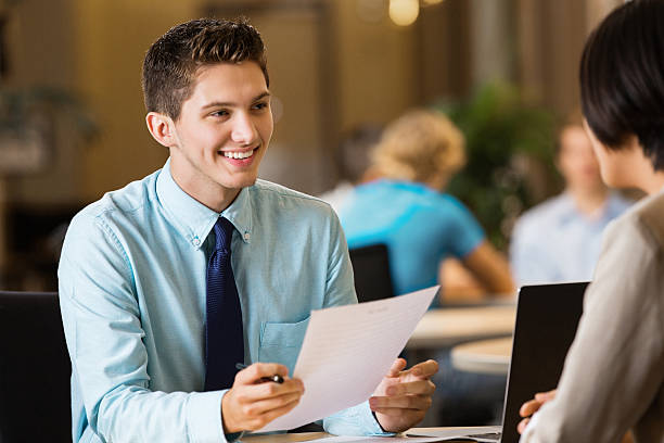 https://aidoos.com/media/images/young-professional-college-student-with-resume-at-job-interview_1_XGULnYj.jpg